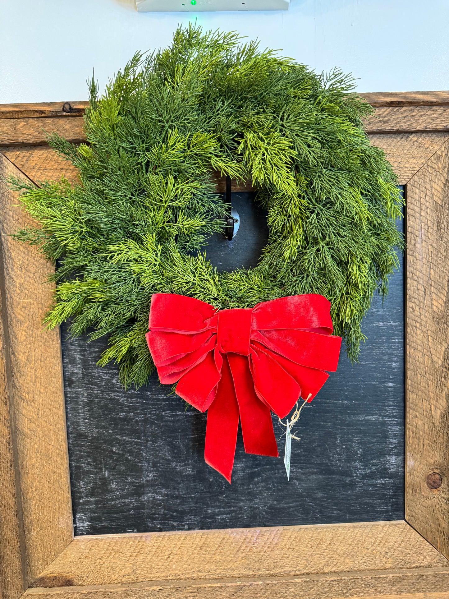 Faux Cedar wreath with red velevt bow
